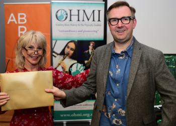 Trombonist, educator and Rath customer Willie McLean receives the OHMI Award from Toyah Willcox